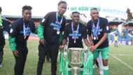 Hashim Sempala Erisa Ssekisambu Jacques Tuyisenge and Shafik Batambuze of Gor Mahia with KPL Trophy.