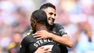 Raheem Sterling of Manchester City celebrates with teammate Riyad Mahrez 2019