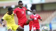 Clifton Miheso of Kenya and Harambee Stars tackle Bhehu Jamuacio.