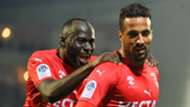 Nimes' Rachid Alioui (R) is congratulated by his teamates Sada Thioub after scoring during a French L1 football match