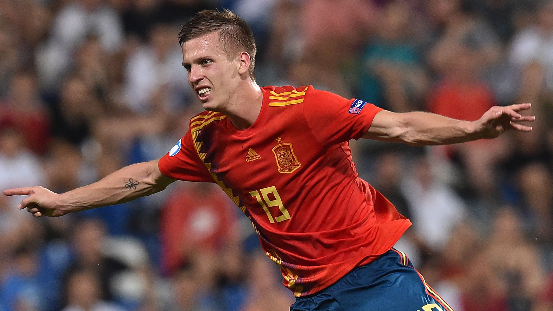  Dani Olmo celebrates a goal for Spain during a soccer match.