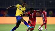 Tanzania's Mbwana Samatta (L) fights for the ball with Kenya's Eric Ouma