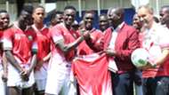William Ruto with Kenya players Victor Wanyama.j