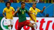 Maxim Choupo-Moting of Cameroon battles with Neymar of Brazil during the 2014 FIFA World Cup Brazil