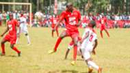 Issa Okumu from St Peters- Mumias heads the ball from Glen Kayumba (in white) from Upper Hill School.