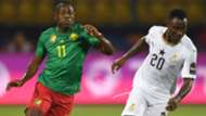 Ghana's midfielder Kwadwo Asamoah (R) is marked by Cameroon's forward Christian Bassogog during the 2019 Africa Cup of Nations.jpg