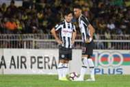 Pahang's Joseph Kalang Tie (left) and Ahmad Syamim Yahya playing against Perak 21/1/2017