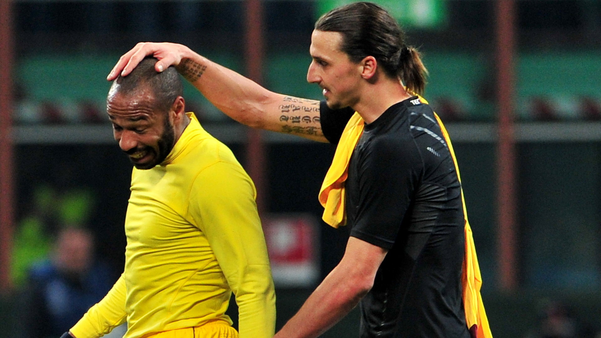  Thierry Henry and Zlatan Ibrahimovic embrace after a football match.