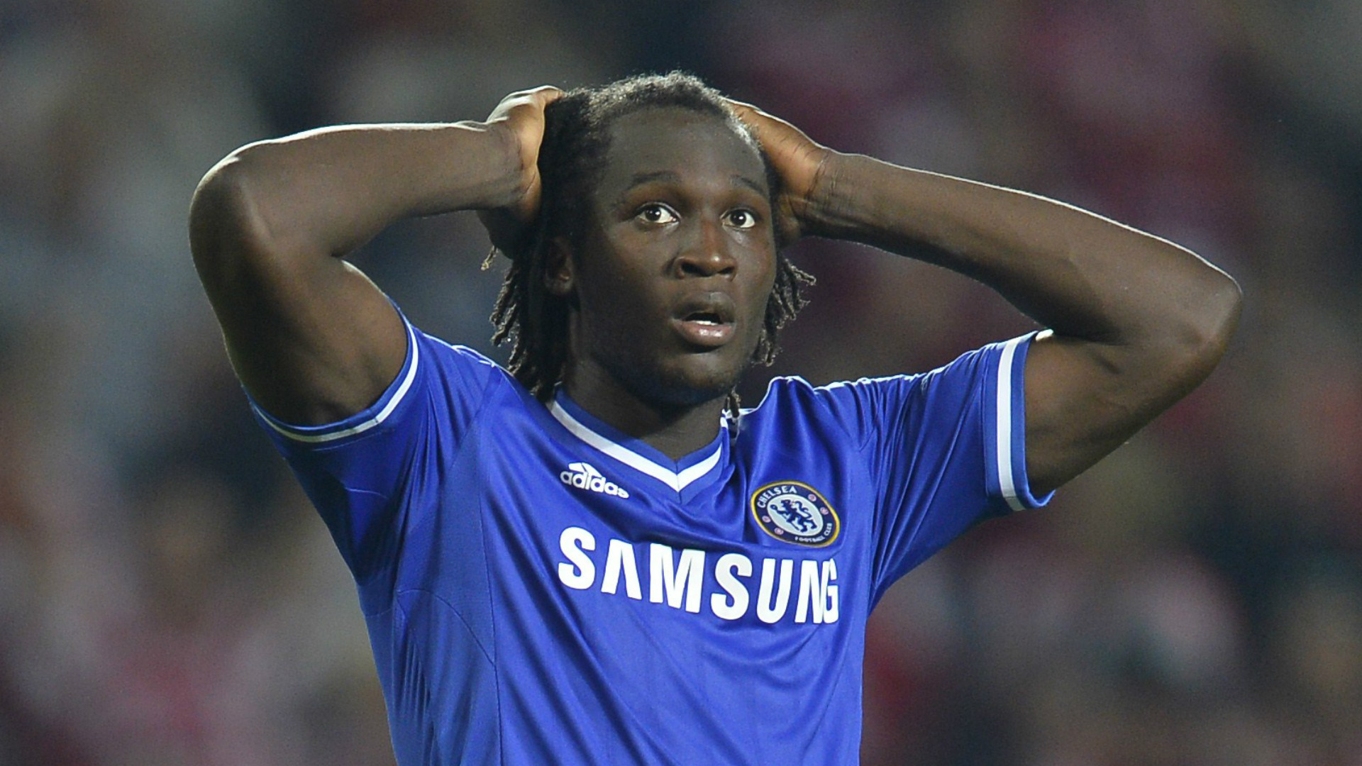  Romelu Lukaku holds his head in his hands while playing for Chelsea.