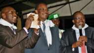 Governor Evans Kdero hands over Sh1 million to Gor Mahia chairman Ambrose Rachier.