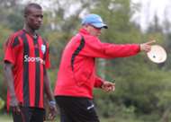 Moussa Sissoko of AFC Leopards with coach Ivan Minnaert