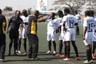 Tusker coach Robert Matano with the squad during match against Mathare..
