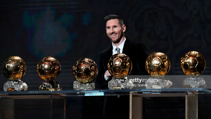 Lionel Messi with his Ballons d'Or