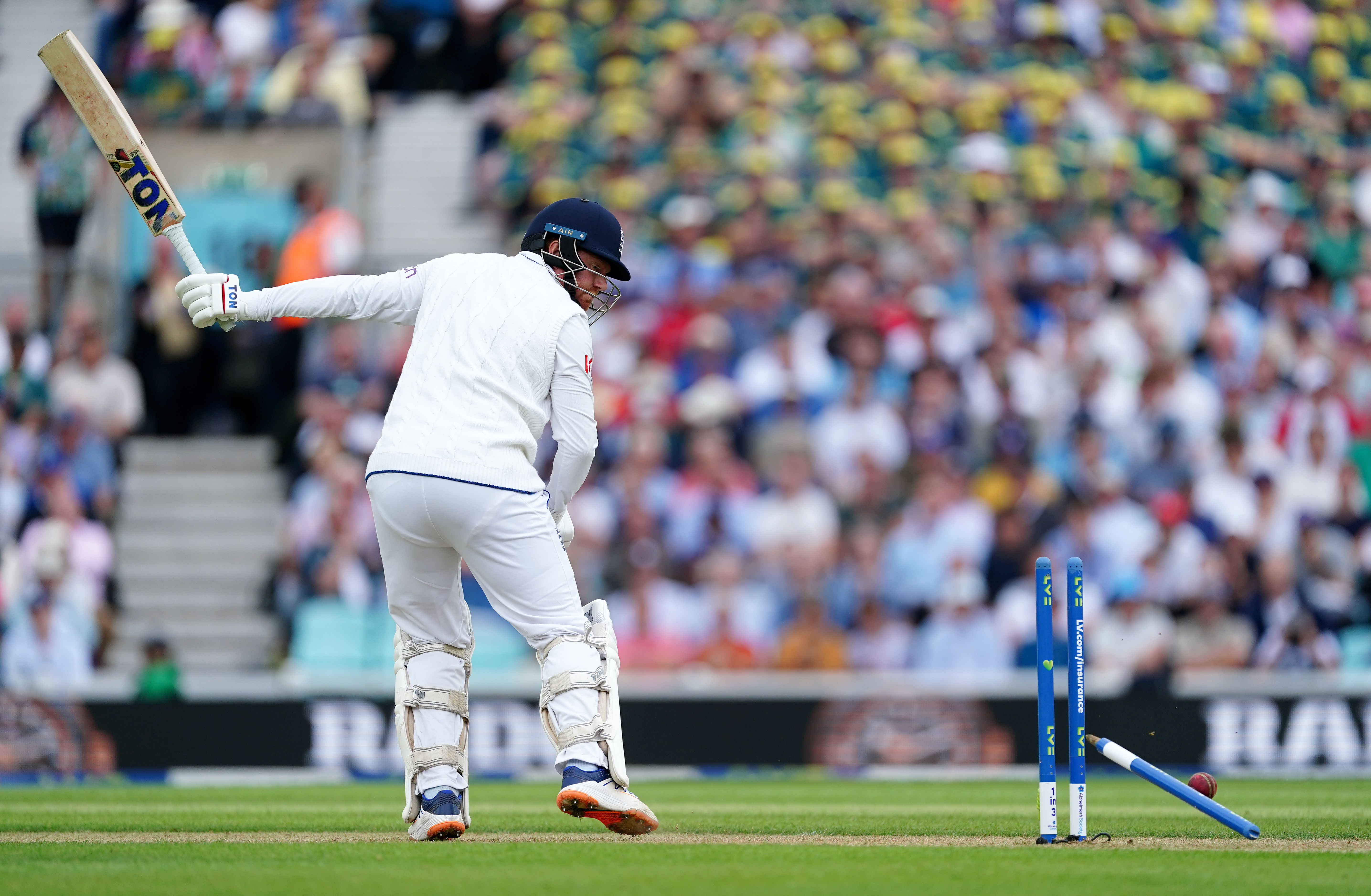 Jonny Bairstow diverts the ball onto his stumps
