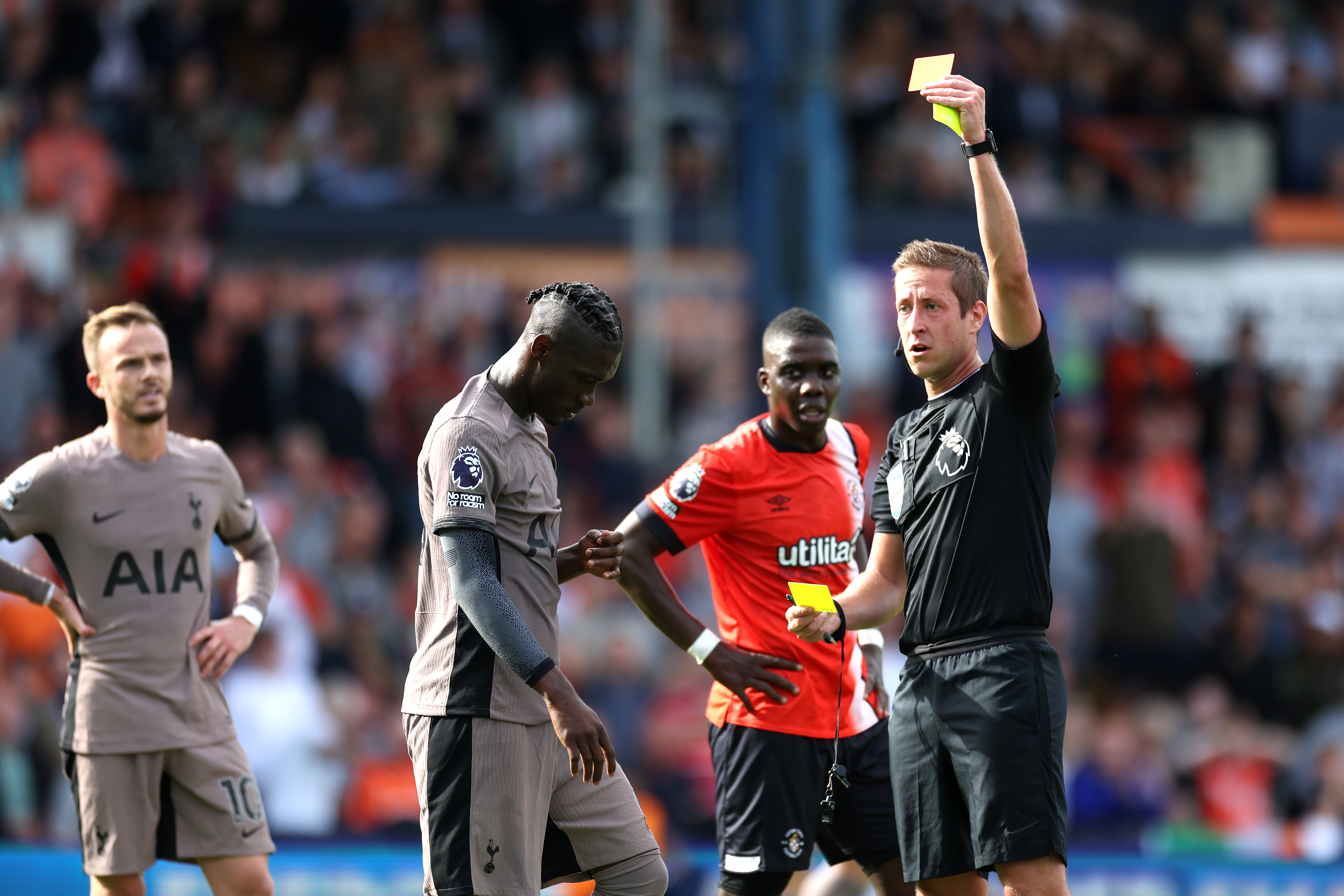 Yves Bissouma is shown a red card by referee John Brooks