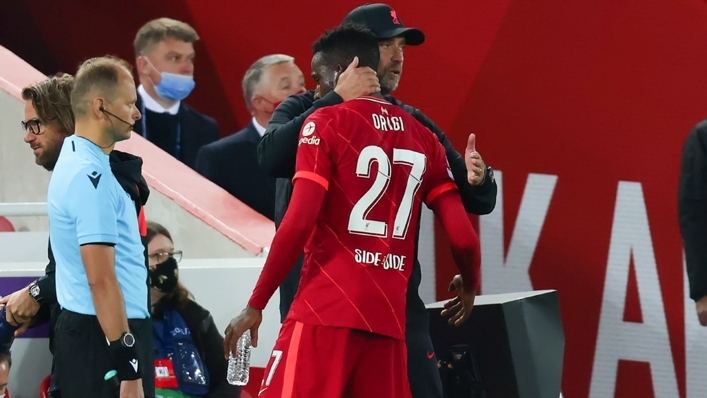 Liverpool manager Jurgen Klopp embraces Divock Origi
