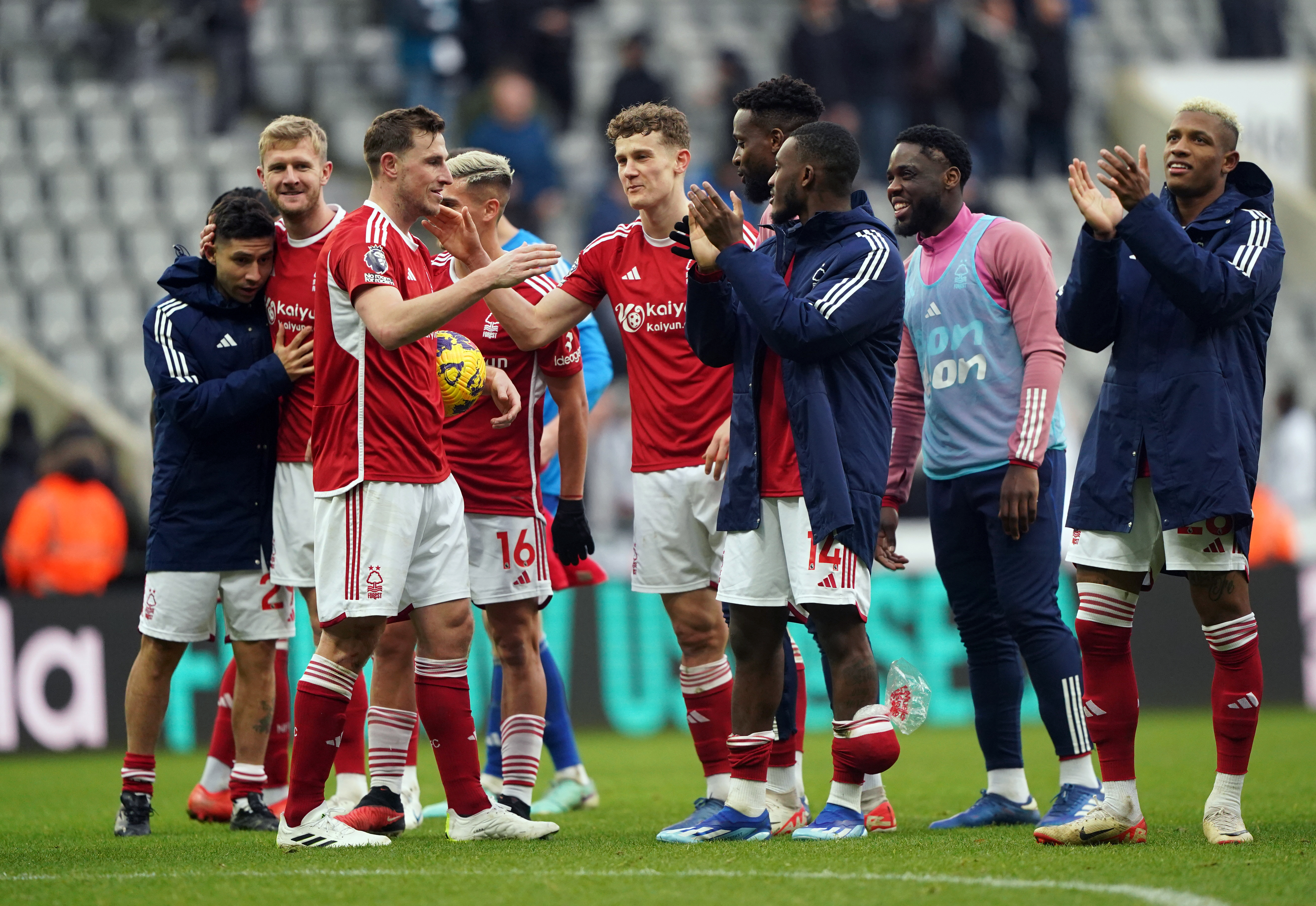 Nottingham Forest’s Chris Wood celebrates with his team-mates after the final whistle at Newcastle