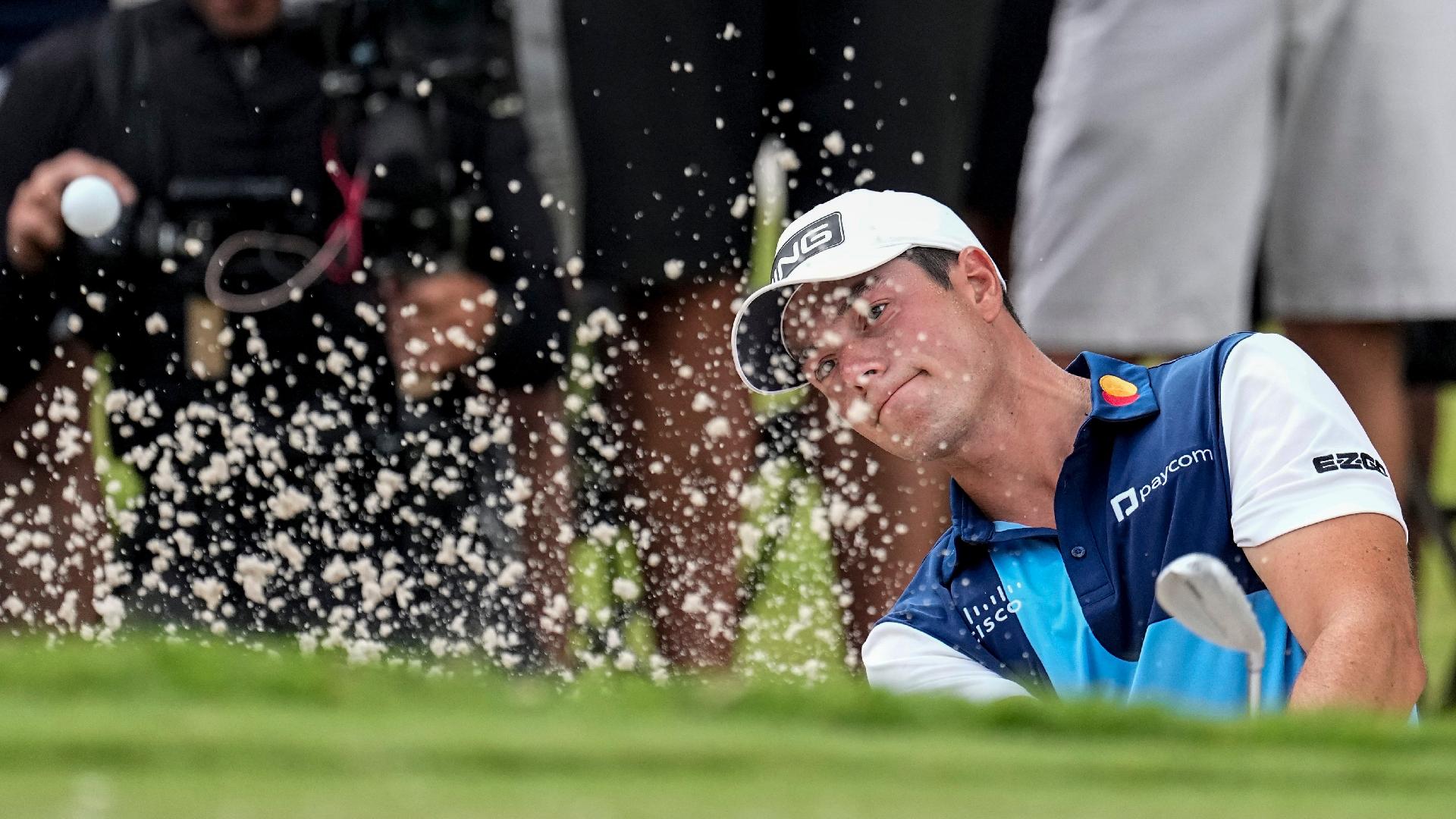 Viktor Hovland hits from a bunker on the second hole during the final round of the Tour Championship (John Bazemore/AP)