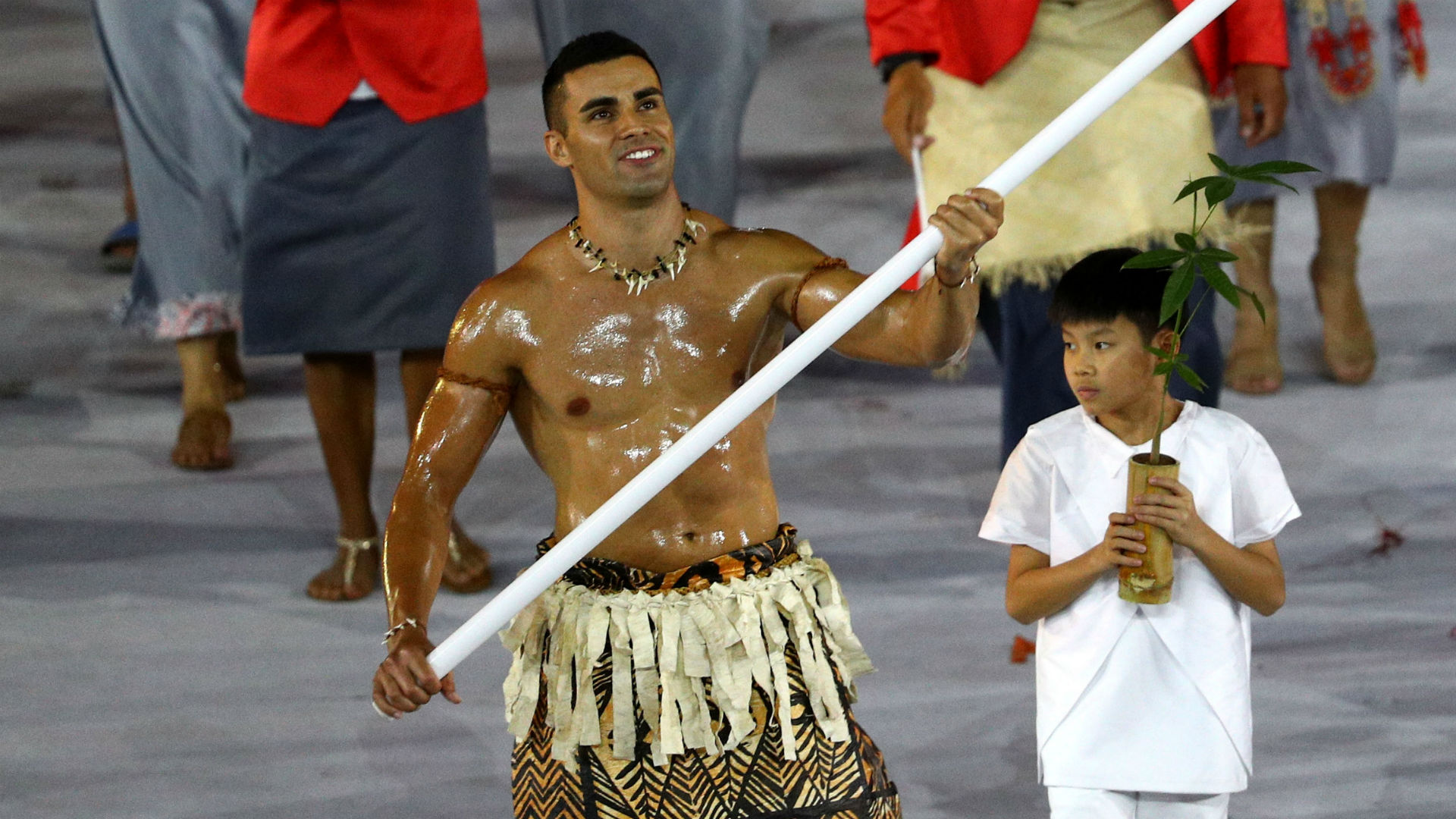 Tonga's oiledup flagbearer qualifies for Winter Games