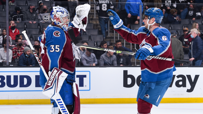 Darcy Kuemper of the Colorado Avalanche celebrates their win with Erik Johnson against the Los Angeles Kings