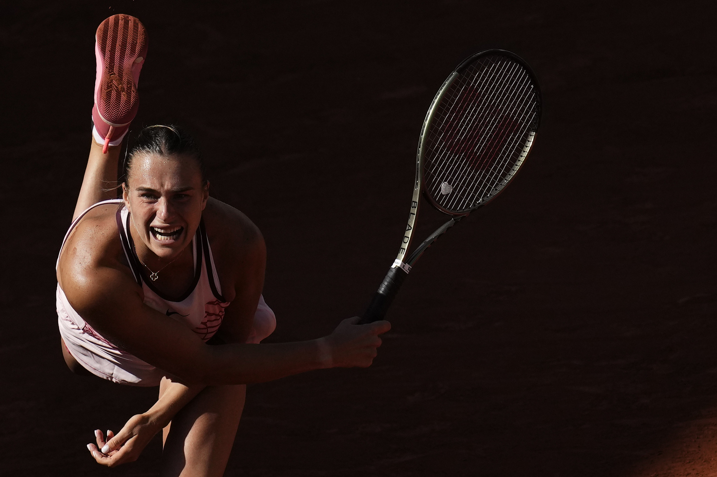 Aryna Sabalenka serves against Iryna Shymanovich