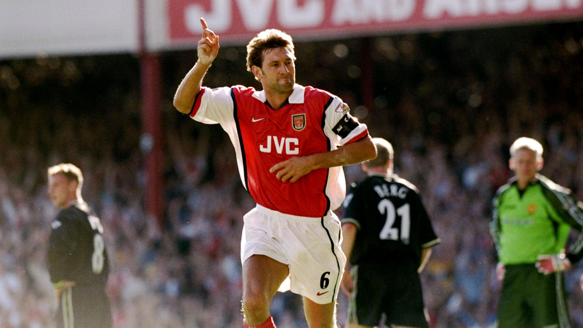  Tony Adams celebrates scoring a goal for Arsenal at Old Trafford.
