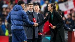 Jude Bellingham greets Steven Gerrard and Jill Scott after England's win on Sunday