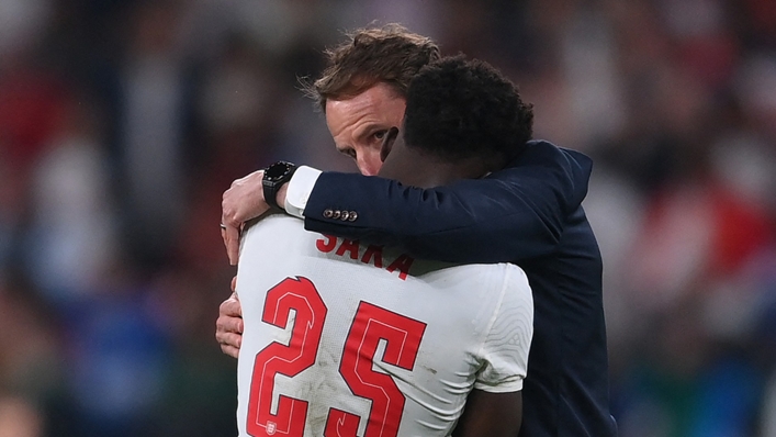 Gareth Southgate consoles Bukayo Saka after the youngster missed his penalty against Italy