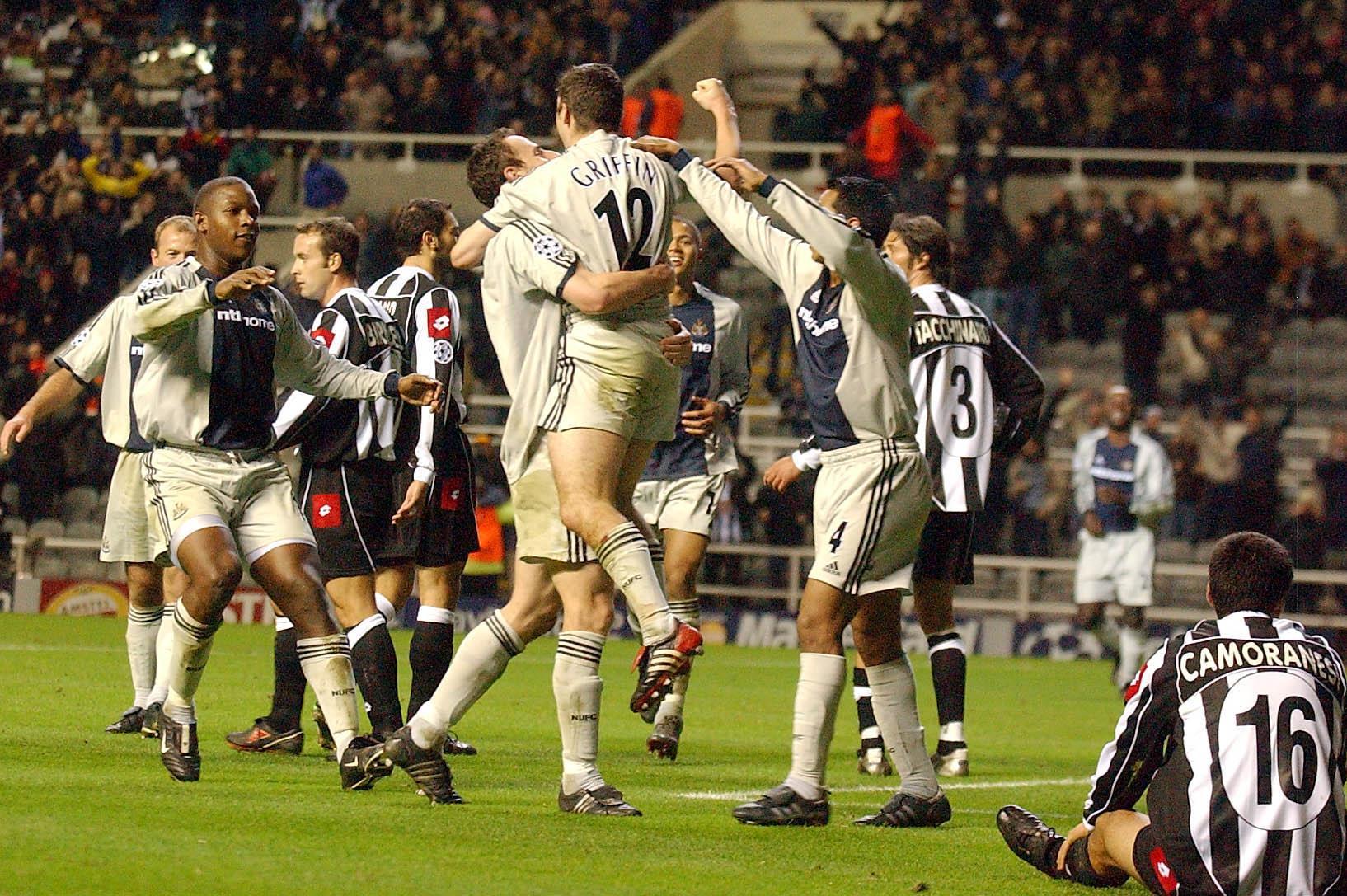 Newcastle celebrate after Andy Griffin beats Juventus keeper Gianluigi Buffon to secure Champions League victory at St James' Park