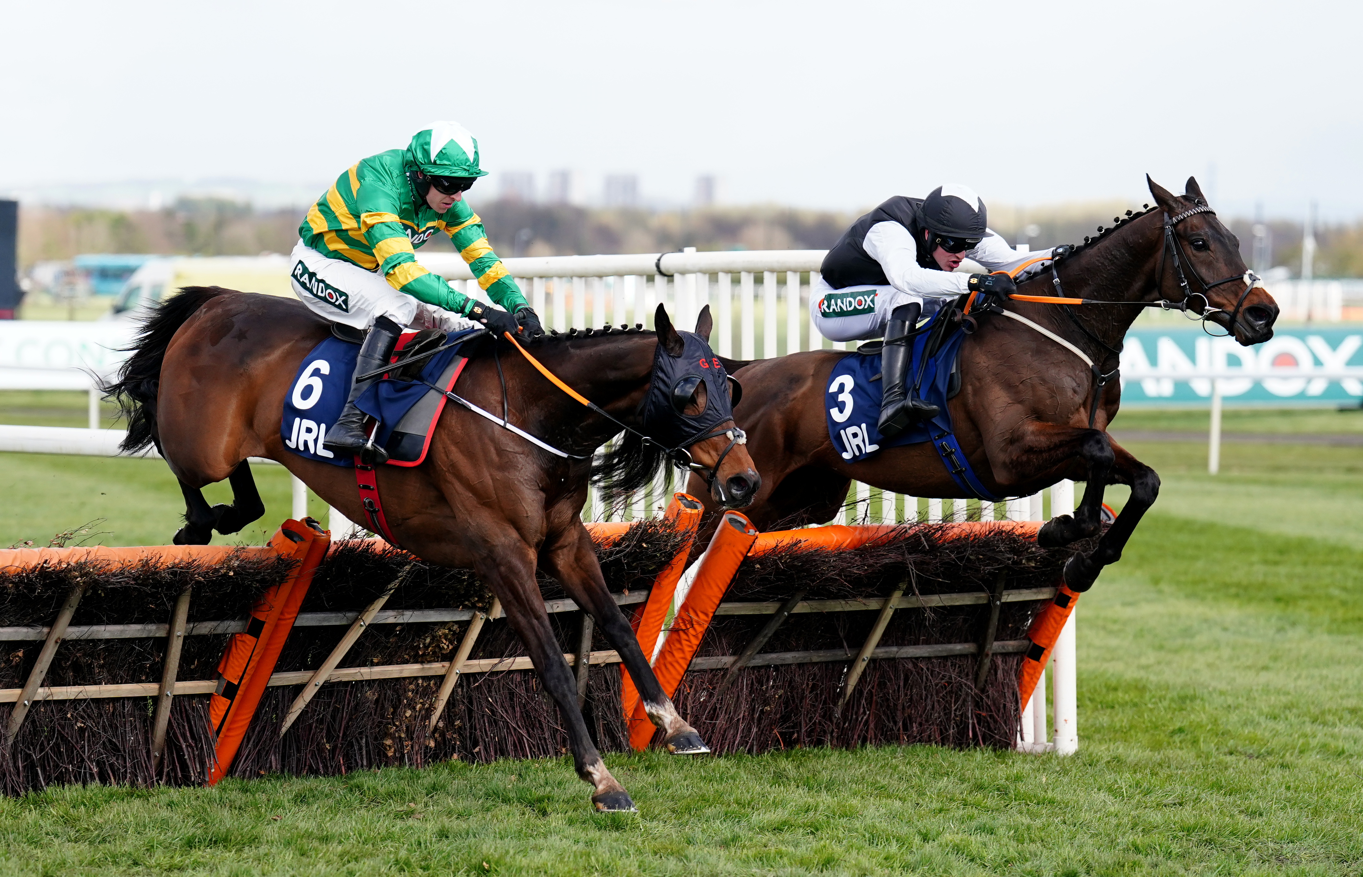 Flooring Porter (right) has lost out to Sire Du Berlais (left) twice at Aintree