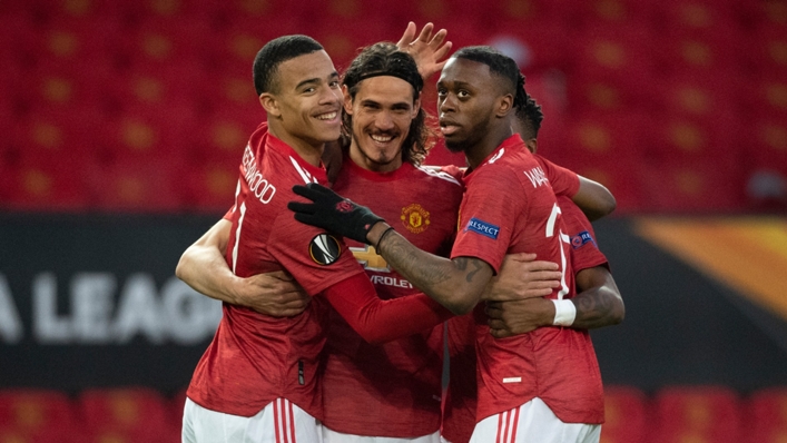 Mason Greenwood (L) and Edinson Cavani (C) celebrate with Aaron Wan-Bissaka (R)