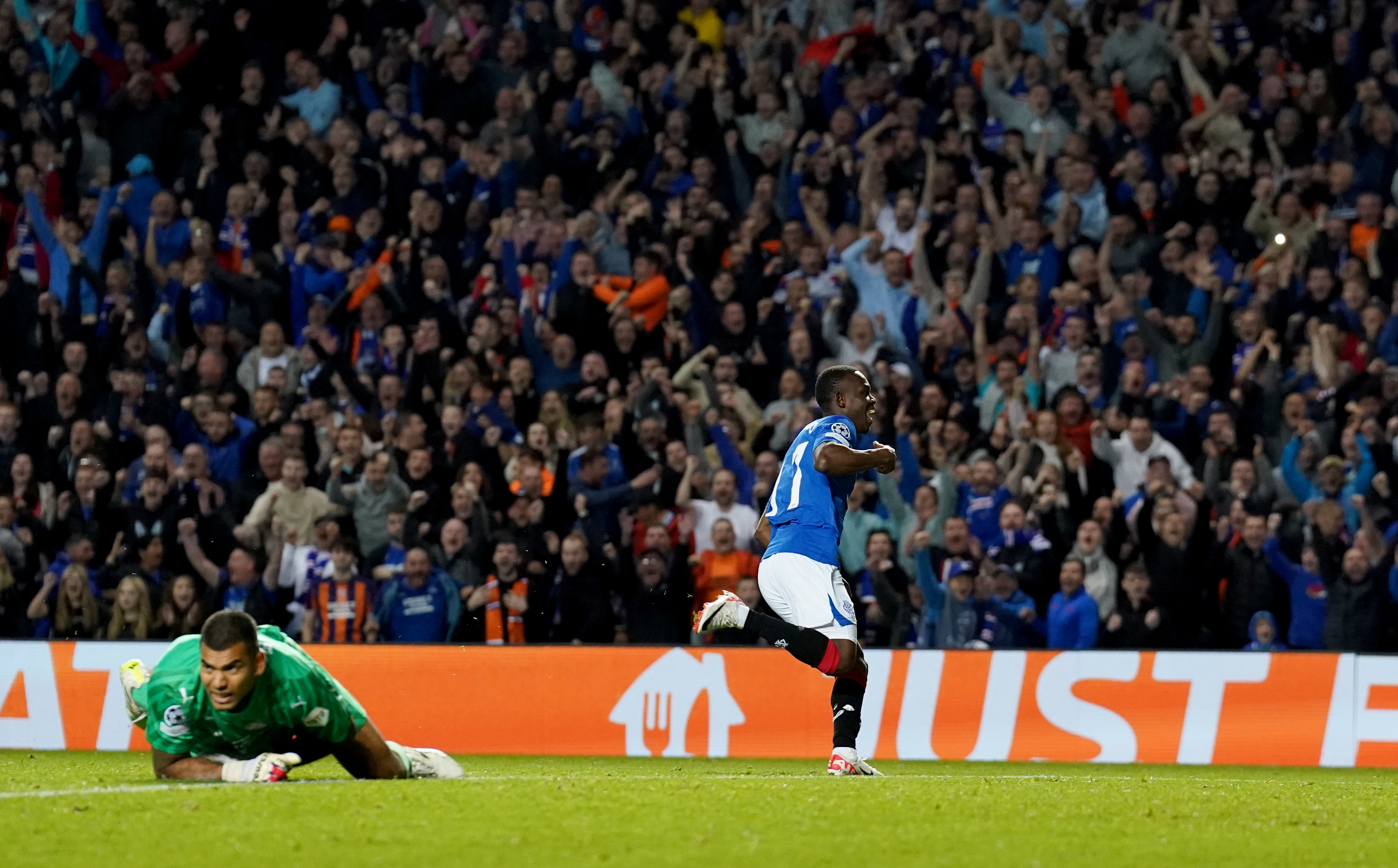 Rabbi Matondo, right, wheels away in celebration after scoring Rangers' second goal
