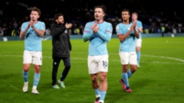 Jack Grealish applauds Manchester City's travelling fans after the win at Chelsea