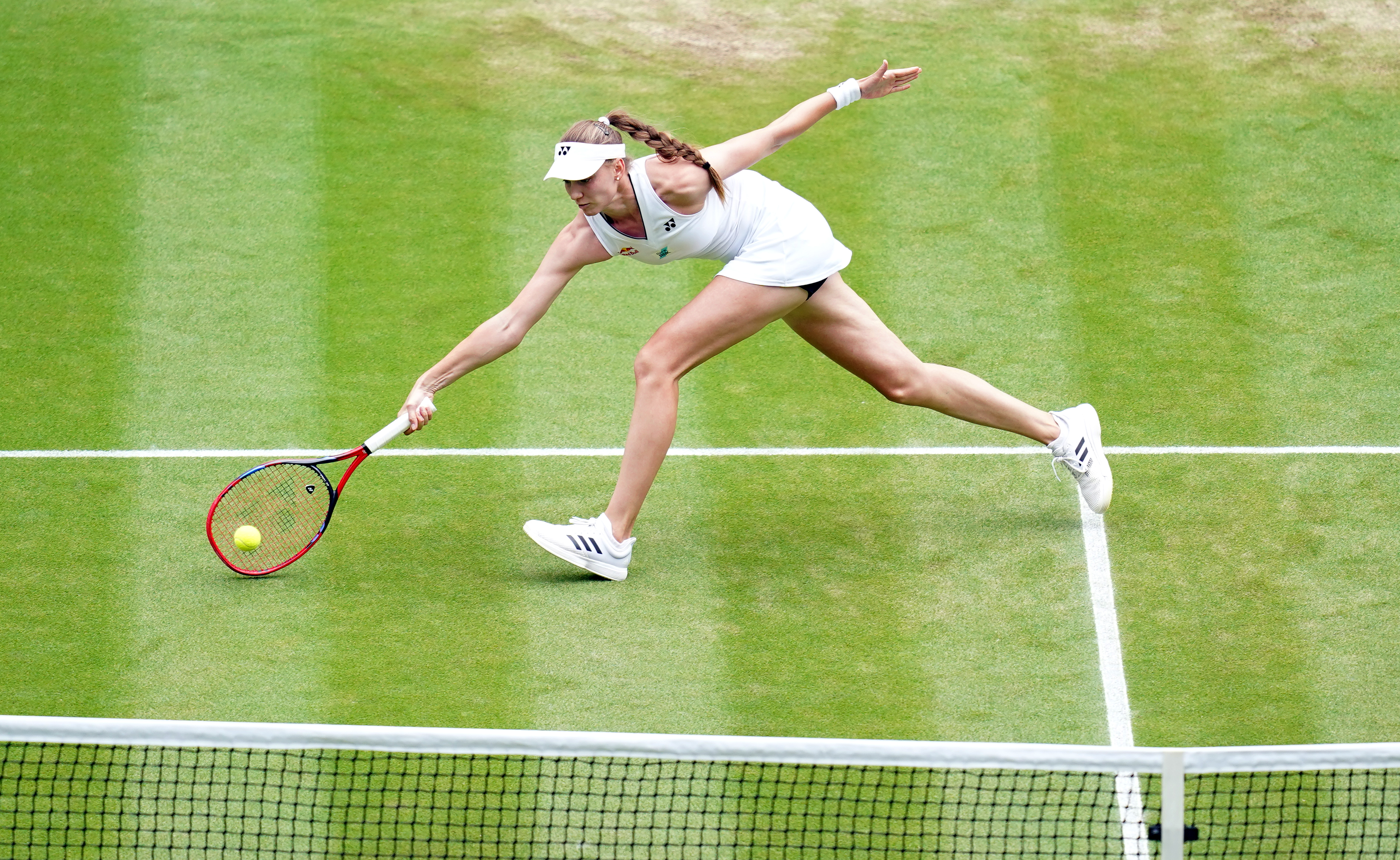 Elena Rybakina lunges for a forehand