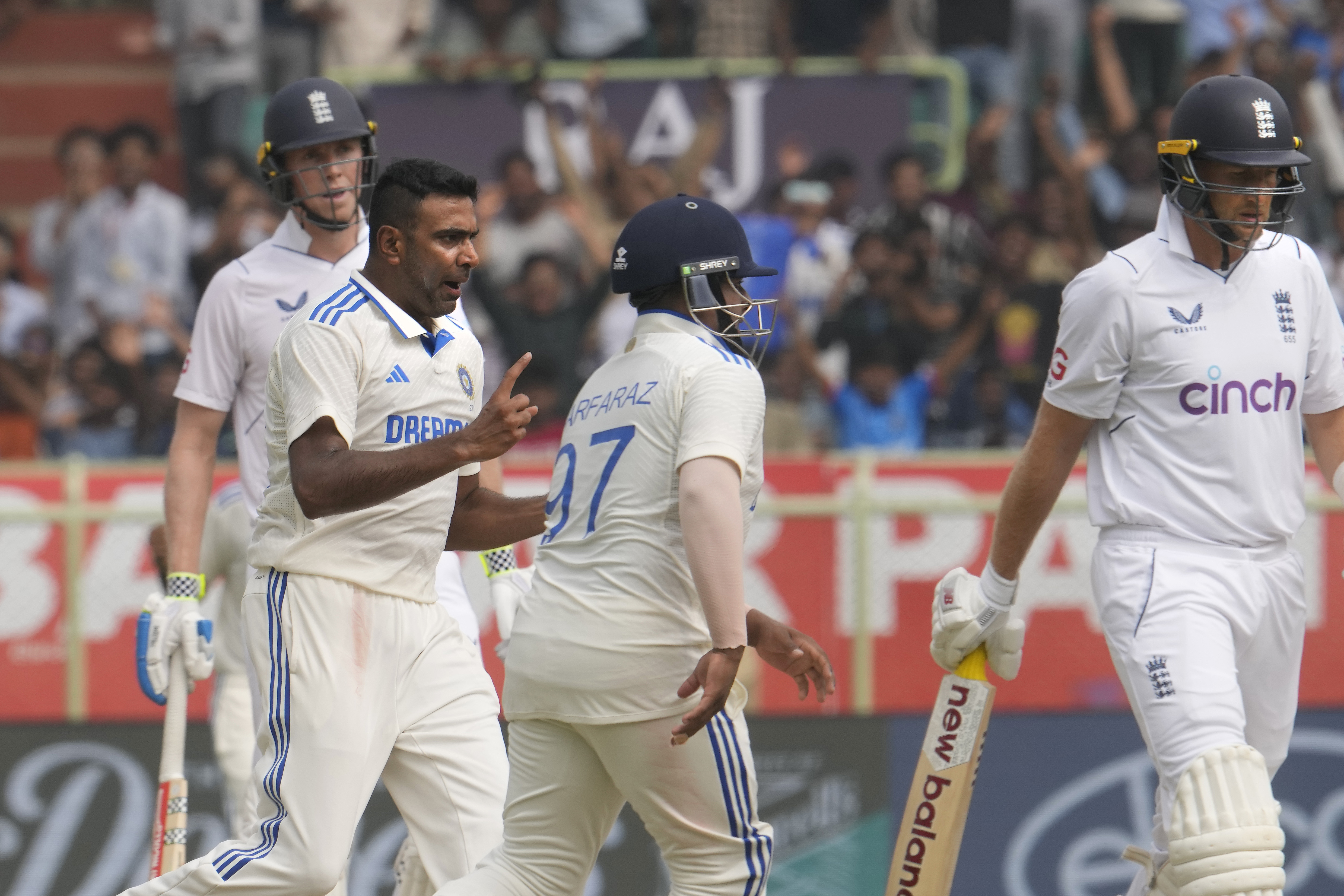 India’s Ravichandran Ashwin, second left, celebrates dismissing Joe Root