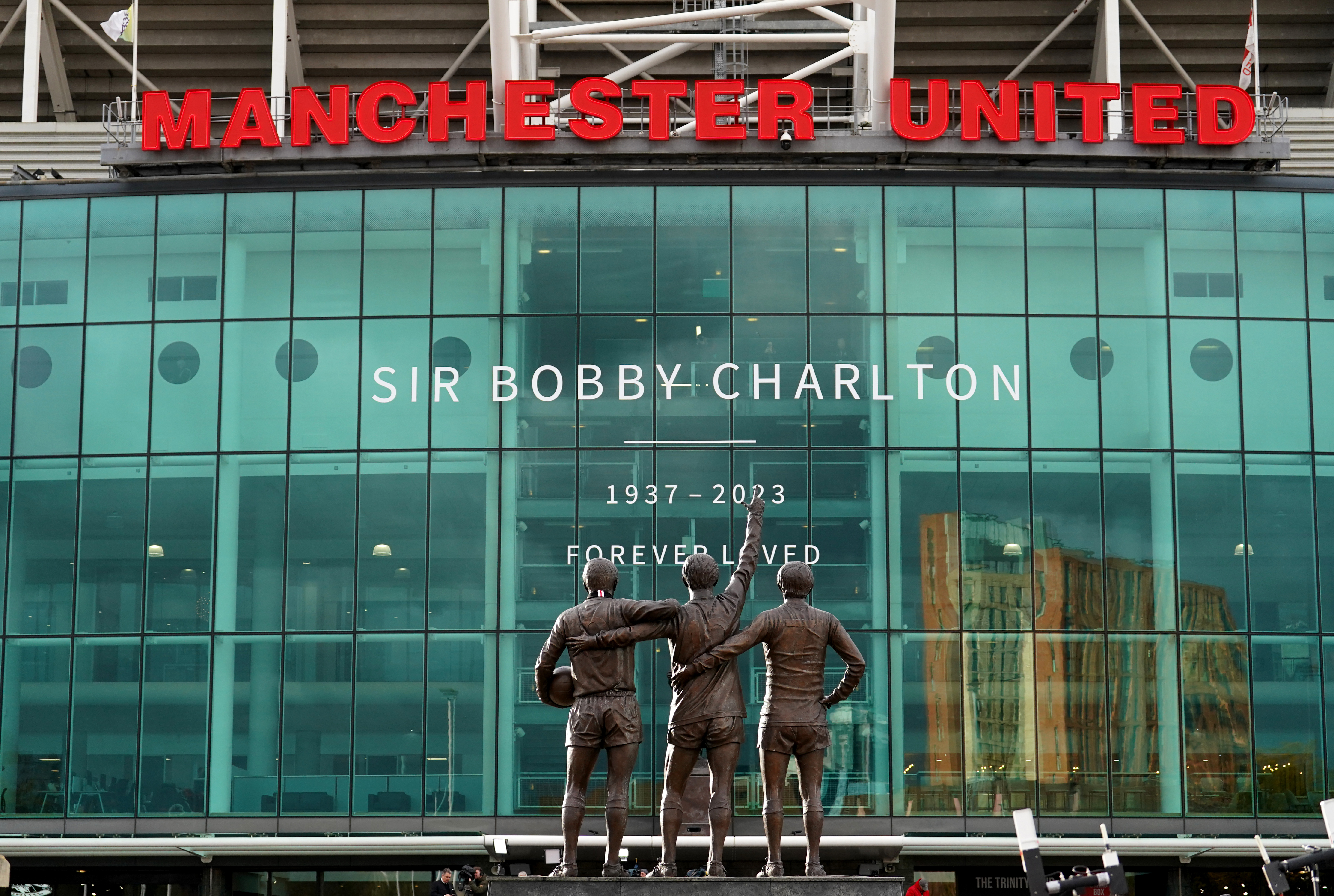 A view of The United Trinity Statue of Sir Bobby Charlton, Denis Law and George Best outside Old Trafford