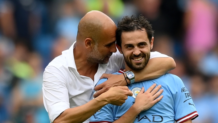 Pep Guardiola (l) embraces Bernardo Silva after the win over Crystal Palace