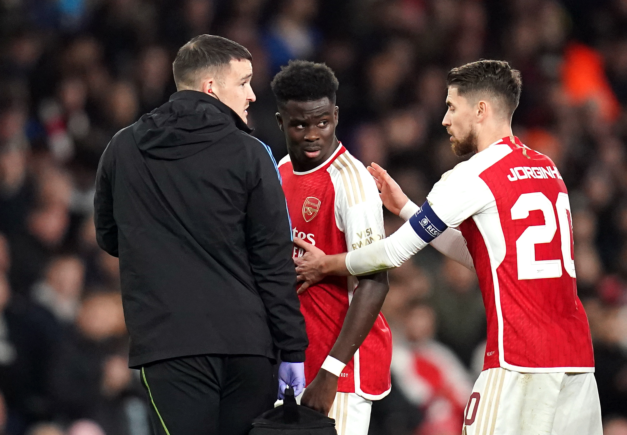 Bukayo Saka, centre, limped off injured with five minutes remaining