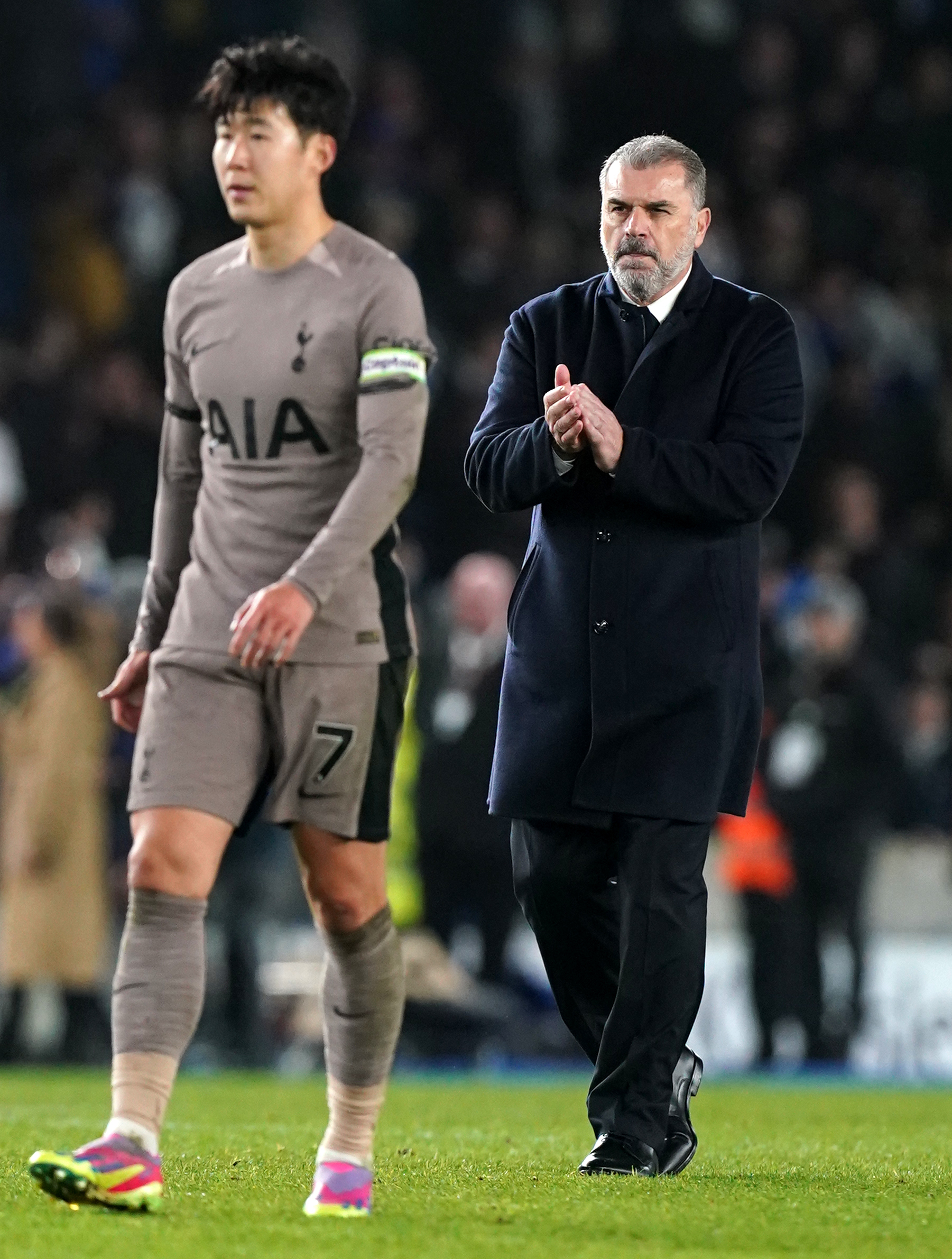 Ange Postecoglou, right, applauds the Tottenham fans after defeat to Brighton