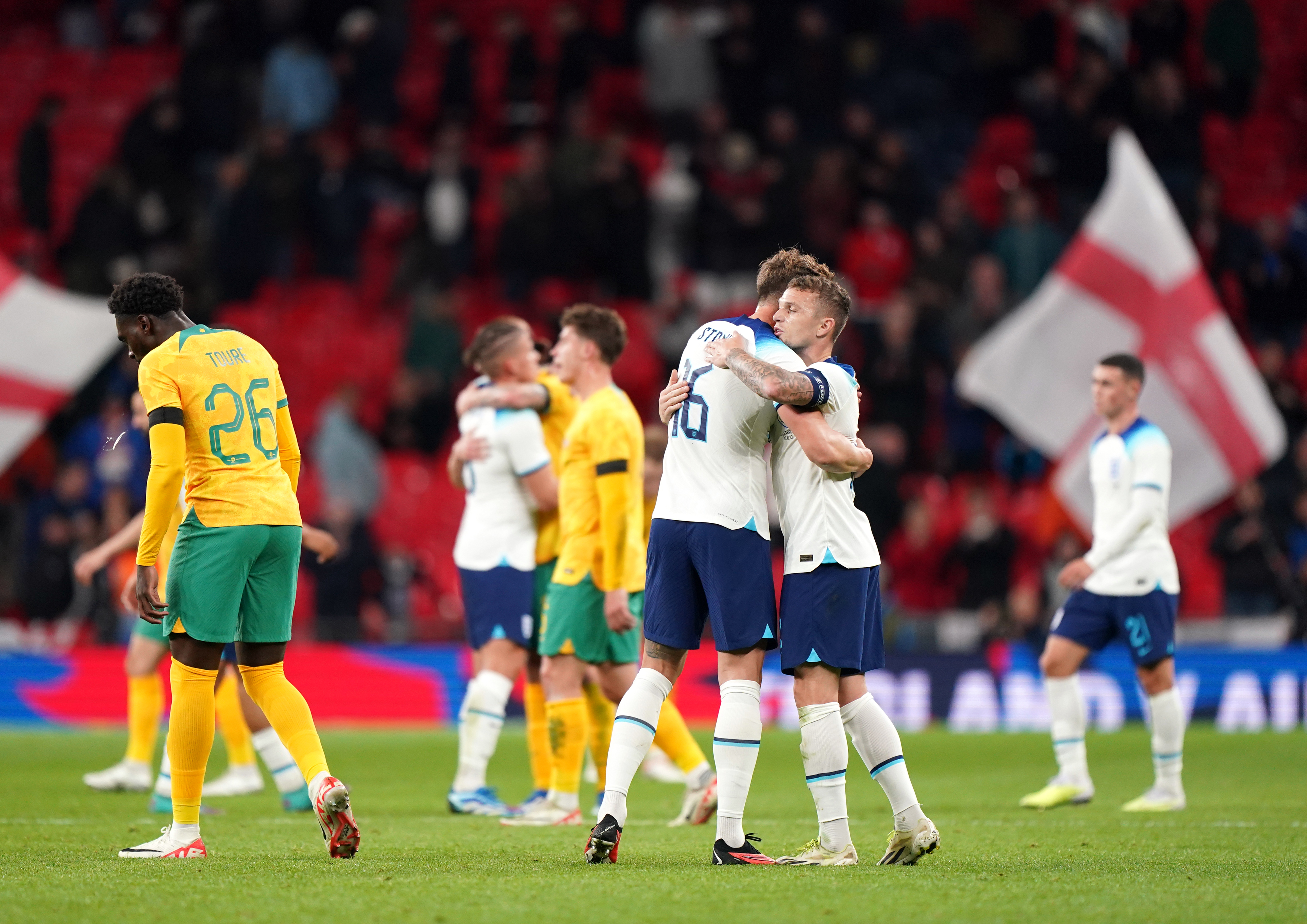 England’s John Stones hugs Kieran Trippier