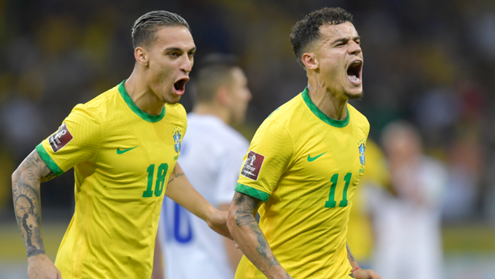 Philippe Coutinho (right) of Brazil celebrates after scoring the second goal of his team during a match between Brazil and Paraguay