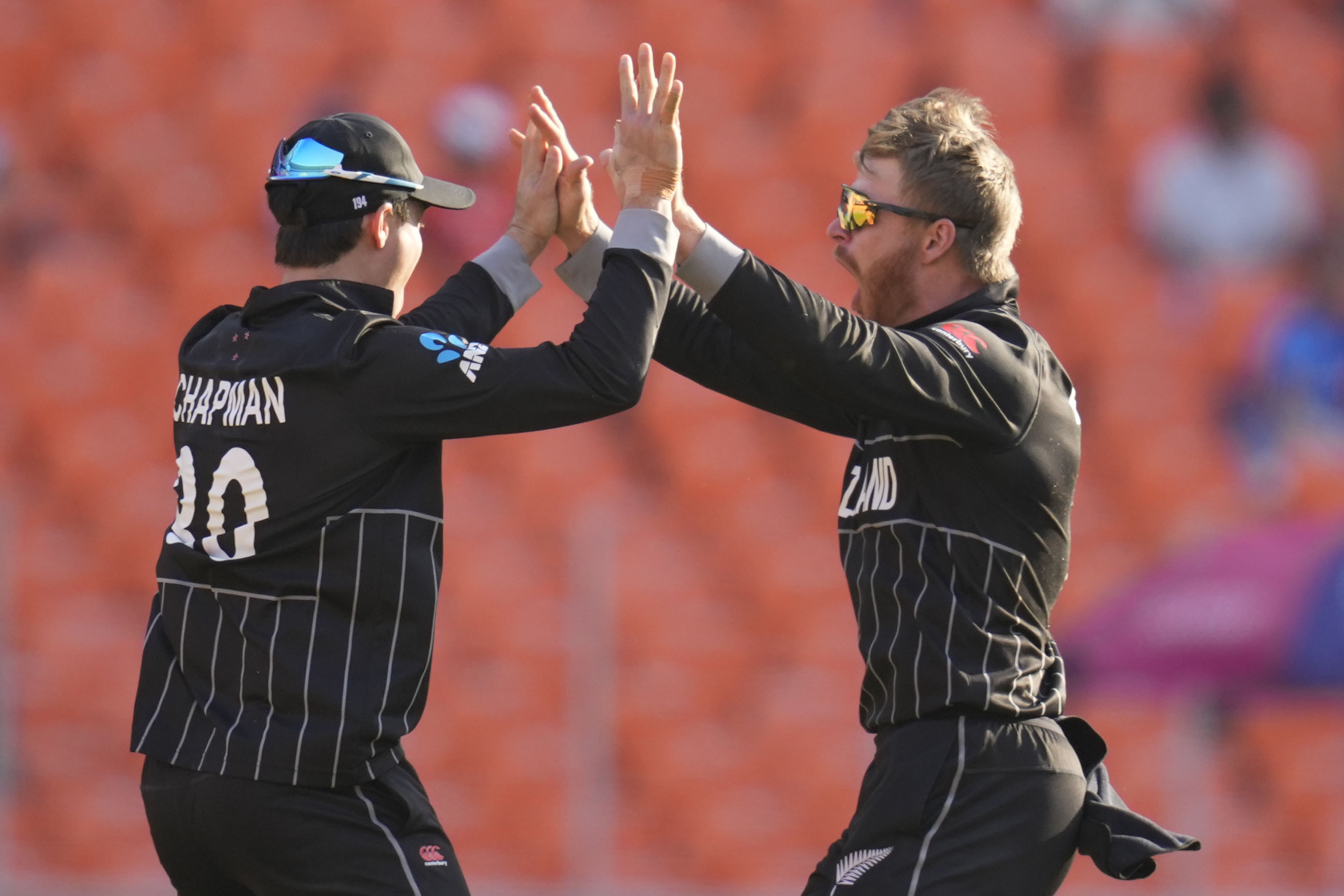 Glenn Phillips, right, picked up two wickets with his part-time spin