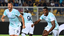 Denzel Dumfries celebrates with fellow Inter substitute Edin Dzeko after scoring against Lecce