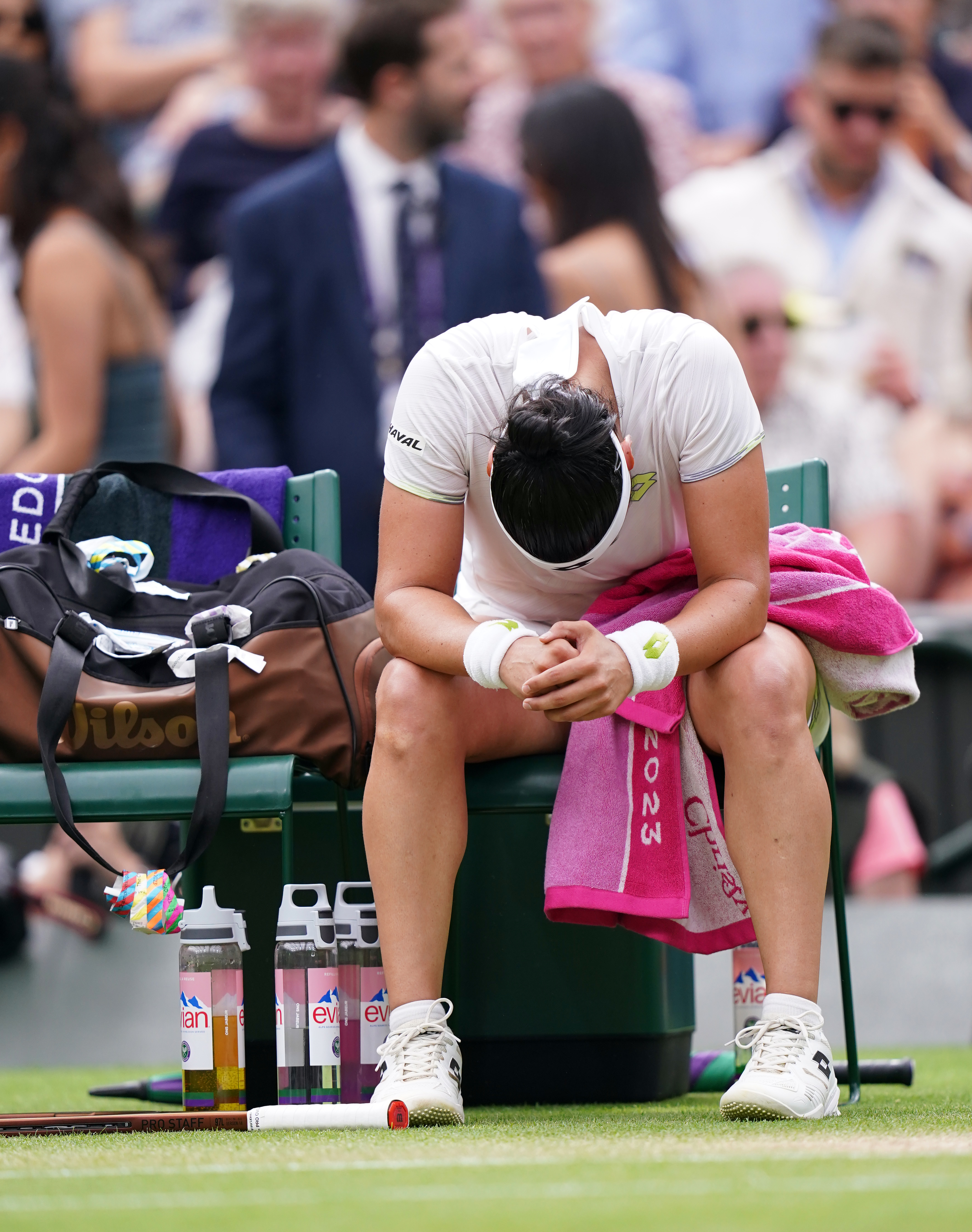 Ons Jabeur hangs her head during a change of ends