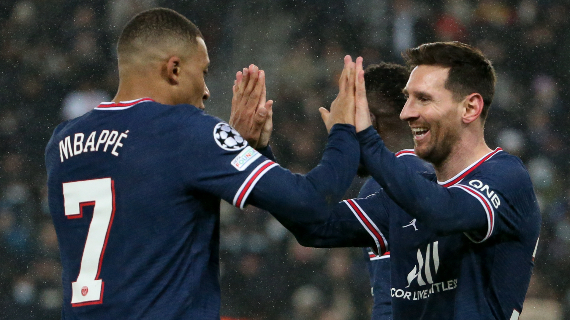 Kylian Mbappe and Lionel Messi celebrate a goal together