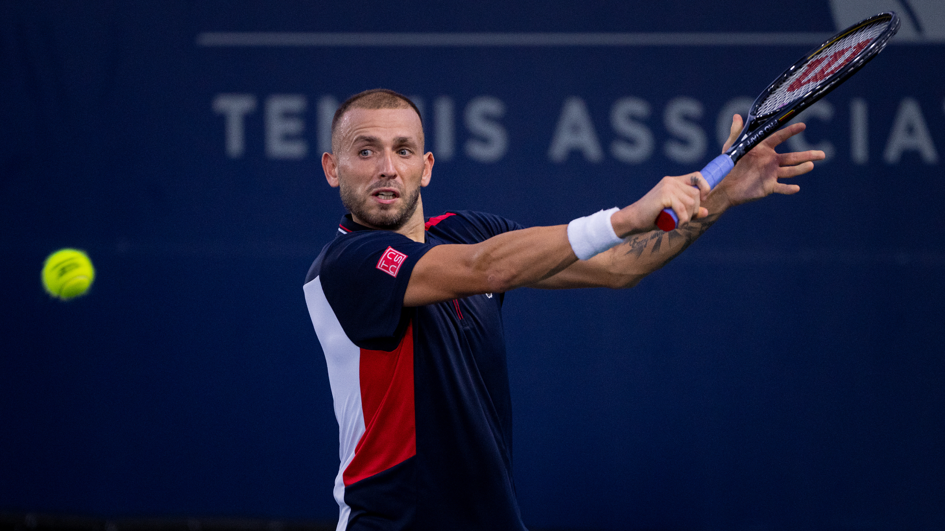 Daniel Evans slices a backhand at the San Diego Open