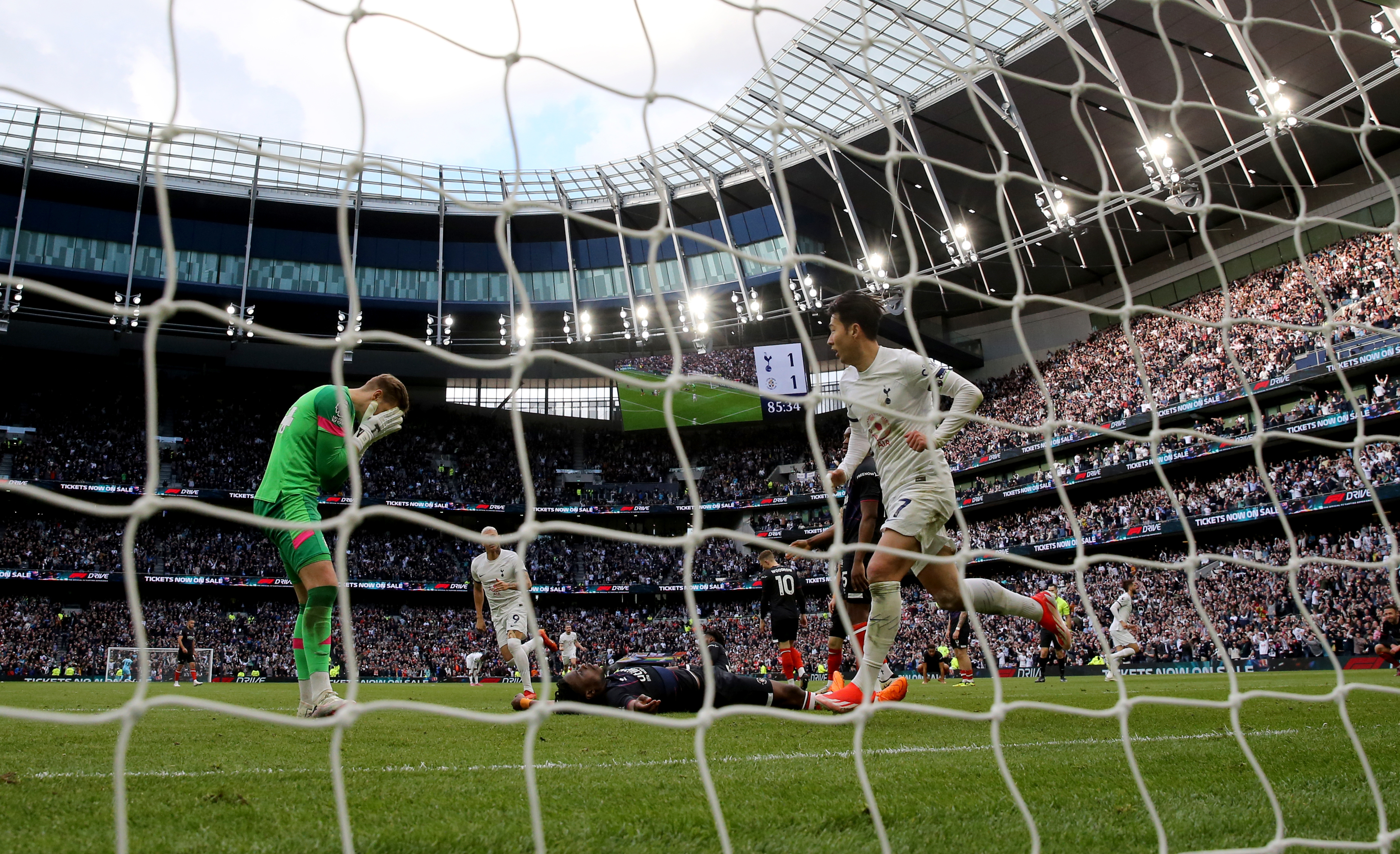 Son Heung-Min (right) celebrates the winner