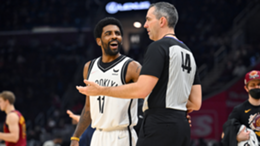 Kyrie Irving of the Brooklyn Nets talks to referee Brett Nansel #44 during the second quarter against the Cleveland Cavaliers at Rocket Mortgage Fieldhouse