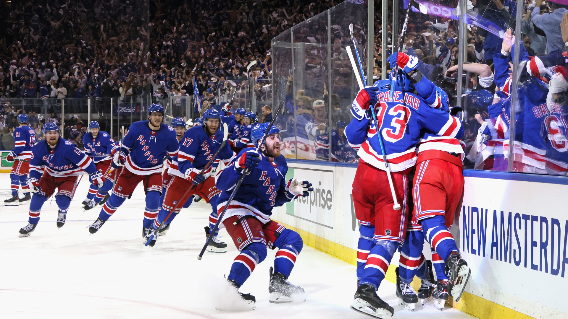 New York Rangers players mob Artemi Panarin after his goal in OT on Sunday