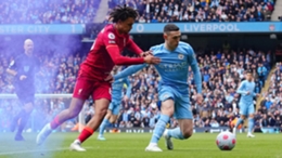 Trent Alexander-Arnold looks to jostle Phil Foden off the ball